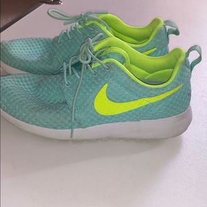 Blue and neon yellow Nike Roshe